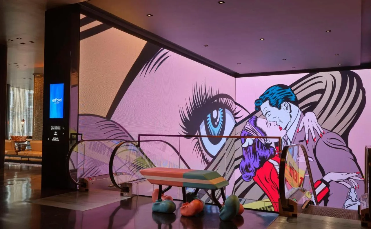 Artwork of a boy and girl on a wall at art'otel London Hoxton