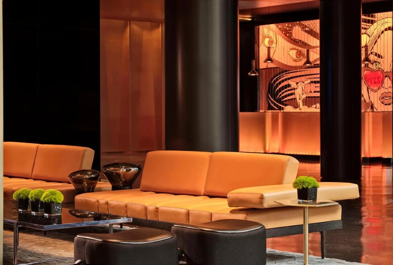Living room-style lounge with sofa and chairs at art'otel London Hoxton